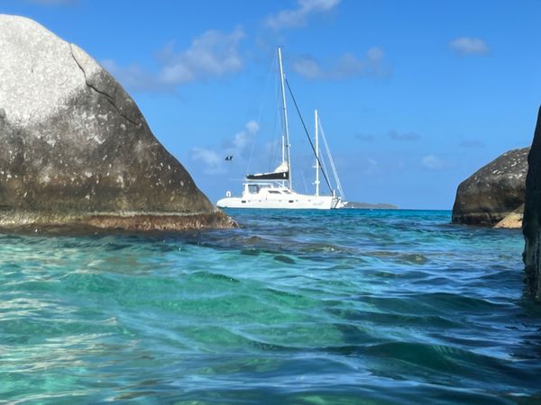 Catamaran anchored near The Baths boulders