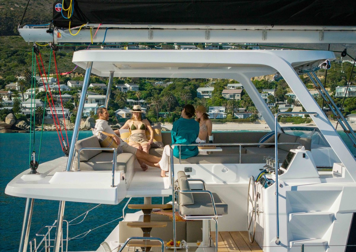 Friends relaxing on the spacious catamaran deck