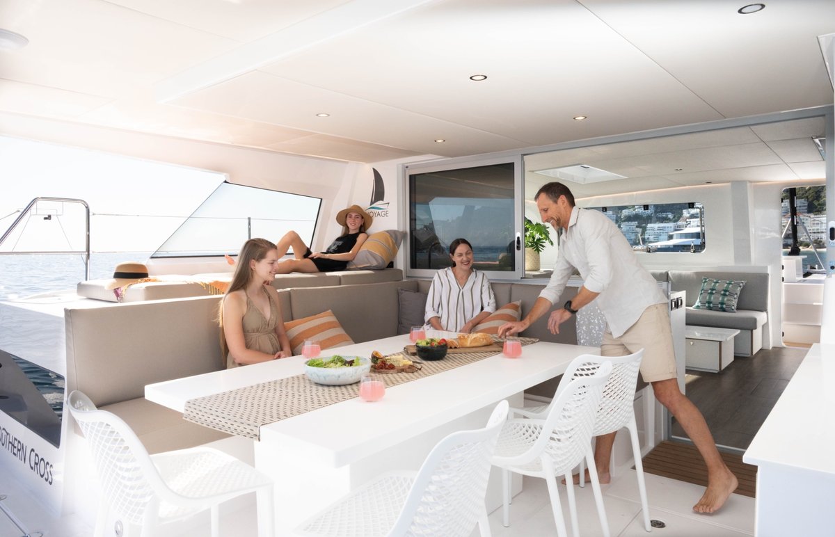 Family dining together on the catamaran